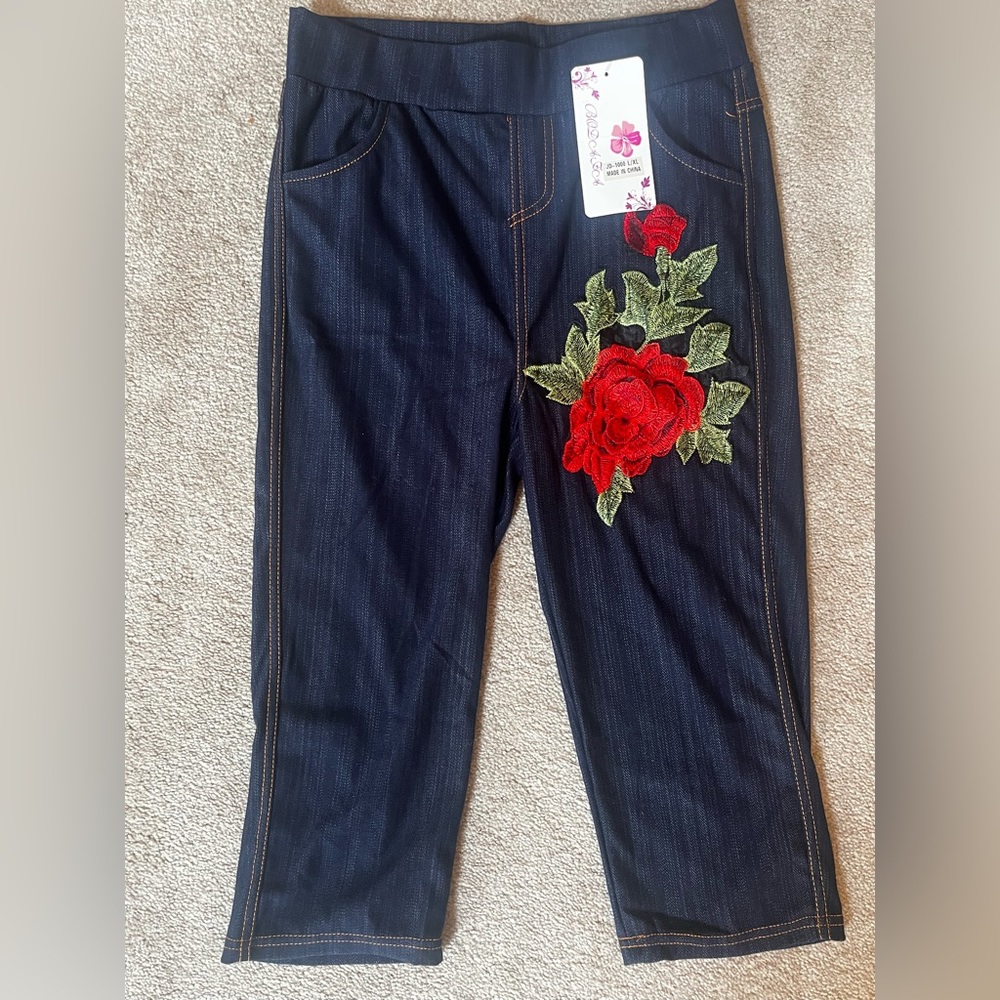 Dark blue jeggings with rose design